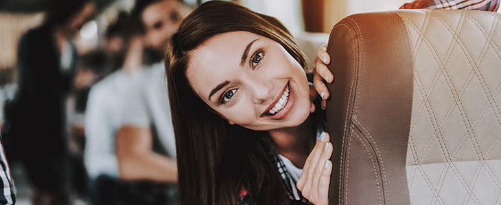 Smiling employee on charter bus